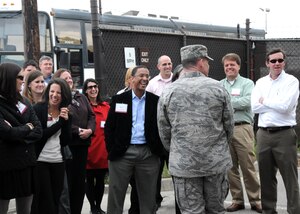U.S. Air Force Lt. Col. Robert Neal entertains nearly 50 Leadership Charleston 2010 class members during a base tour at Joint Base Charleston, S.C., March 18, 2010. Leadership Charleston is a year-long program for professionals offering an intensive look at various sectors of the community, which involves interaction with local military agencies. The tour gave the class a review of the base's capabilities and discussed Joint Base Charleston?s importance to the warfighter. Colonel Neal is the 437th Aerial Port Squadron commander. (U.S. Air Force photo/Staff Sgt. Daniel Bowles)