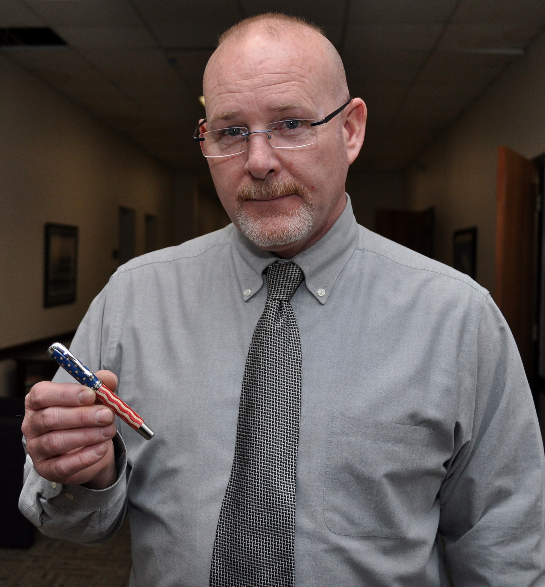 SCOTT AIR FORCE BASE, Ill. -- Steve Engler, a program analyst for U.S. Transportation Command, displays a pen he made similar to the one presented to Gen. Norton Schwarz by the mayor of O'Fallon, Ill., when General Schwartz became the Chief of Staff of the Air Force. (U.S. Air Force Photo/Bob Fehringer)