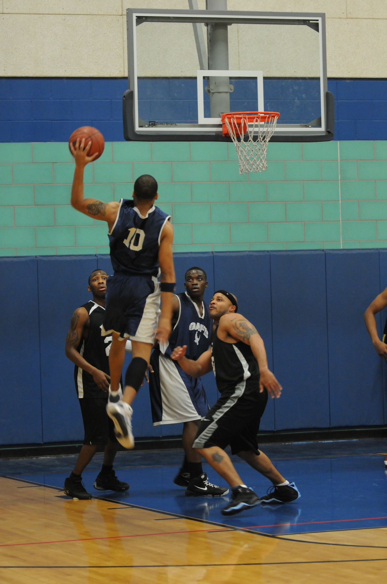 GOODFELLOW AIR FORCE BASE, Texas -- Michael Thompson, 17th Force Support Squadron, attempts to score against Dyess Air Force Base during the varsity basketball match, March 19, 2010. Goodfellow has two more home games, March 27 and 28, both against Randolph. (U.S. Air Force photo/Airman 1st Class Clayton Lenhardt)