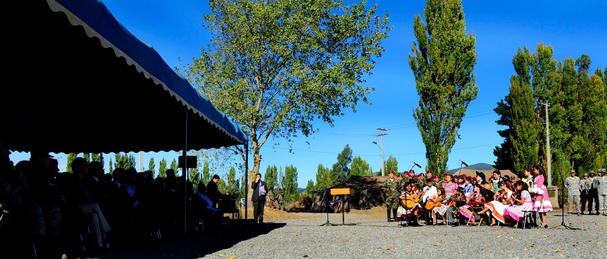 Chilean children perform during the donation ceremony of the expeditionary hospital to the citizens of Angol March 24, 2010, in Angol, Chile. The local hospital in Angol, a city southeast of Conception, Chile, was deemed structurally unsound as a result of an 8.8-magnitude earthquake Feb. 27. With the nearest operation ward more than 40 miles away, and many other local hospitals overwhelmed with casualties following the earthquake, local Chilean officials requested assistance from U.S. forces to help with primary care capabilities. (U.S. Air Force photo/Senior Airman Tiffany Trojca)

