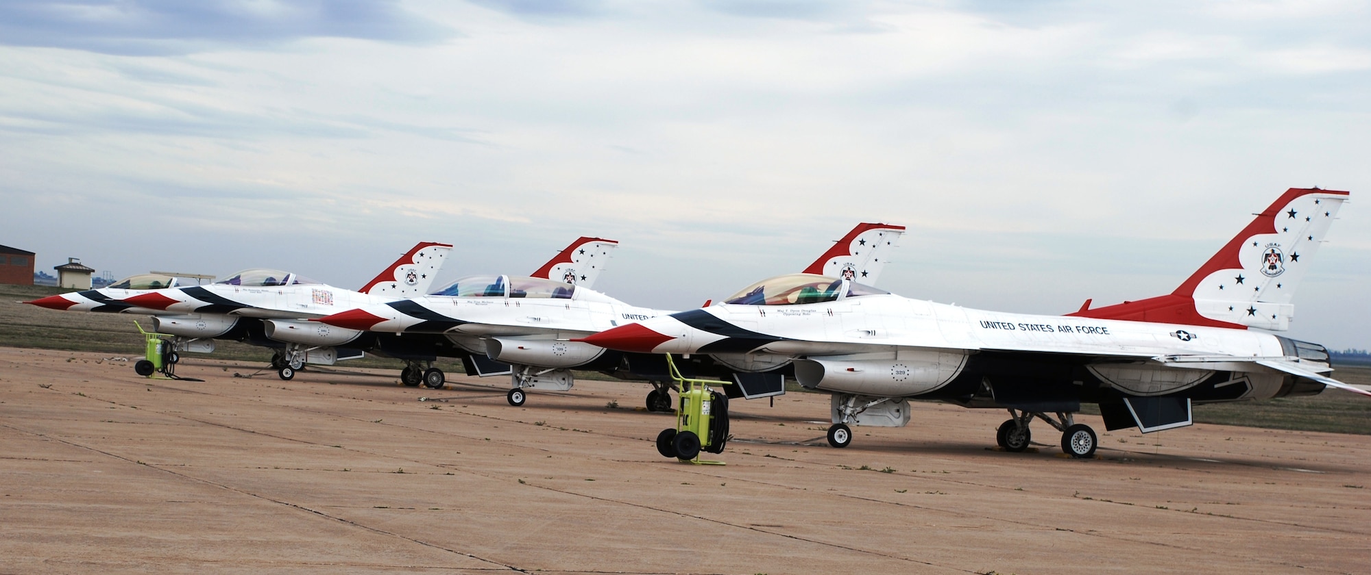 Four former Thunderbird Demonstration team F-16s sit at Bldg. 1630 March 24 while waiting to undergo the demilitarization process. These aircraft will become trainers for the 362nd Training Squadron. The fifth former Thunderbird F-16 is scheduled to arrive within the next week. (U.S. Air Force photo/Airman 1st Class Valerie Hosea)