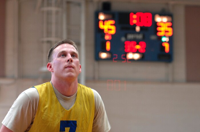 U.S. Air Force Capt. Bradley Lane concentrates before his free throw during an intramural basketball game held at the Fitness and Sports Center March 23, 2010, at Joint Base Charleston, S.C. The 16th Airlift Squadron beat the 4th and 1/18th Infantry Division Army basketball team 47-37. (U.S. Air Force photo/Senior Airman Timothy Taylor)