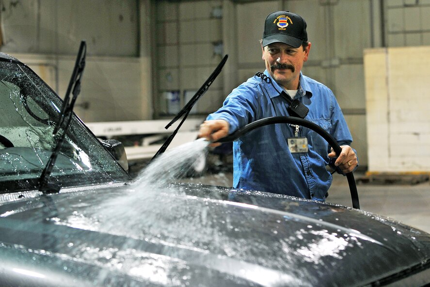 OFFUTT AIR FORCE BASE, Neb. - Mike Wangberg, work leader with the 55th Mission Support Group's Logistics Support Division, washes a vehicle inside Bldg. D March 19. The division's vehicle operations section takes care of Offutt's transportation needs using a fleet of more than 60 vehicles.  

U.S. Air Force photo by Charles Haymond