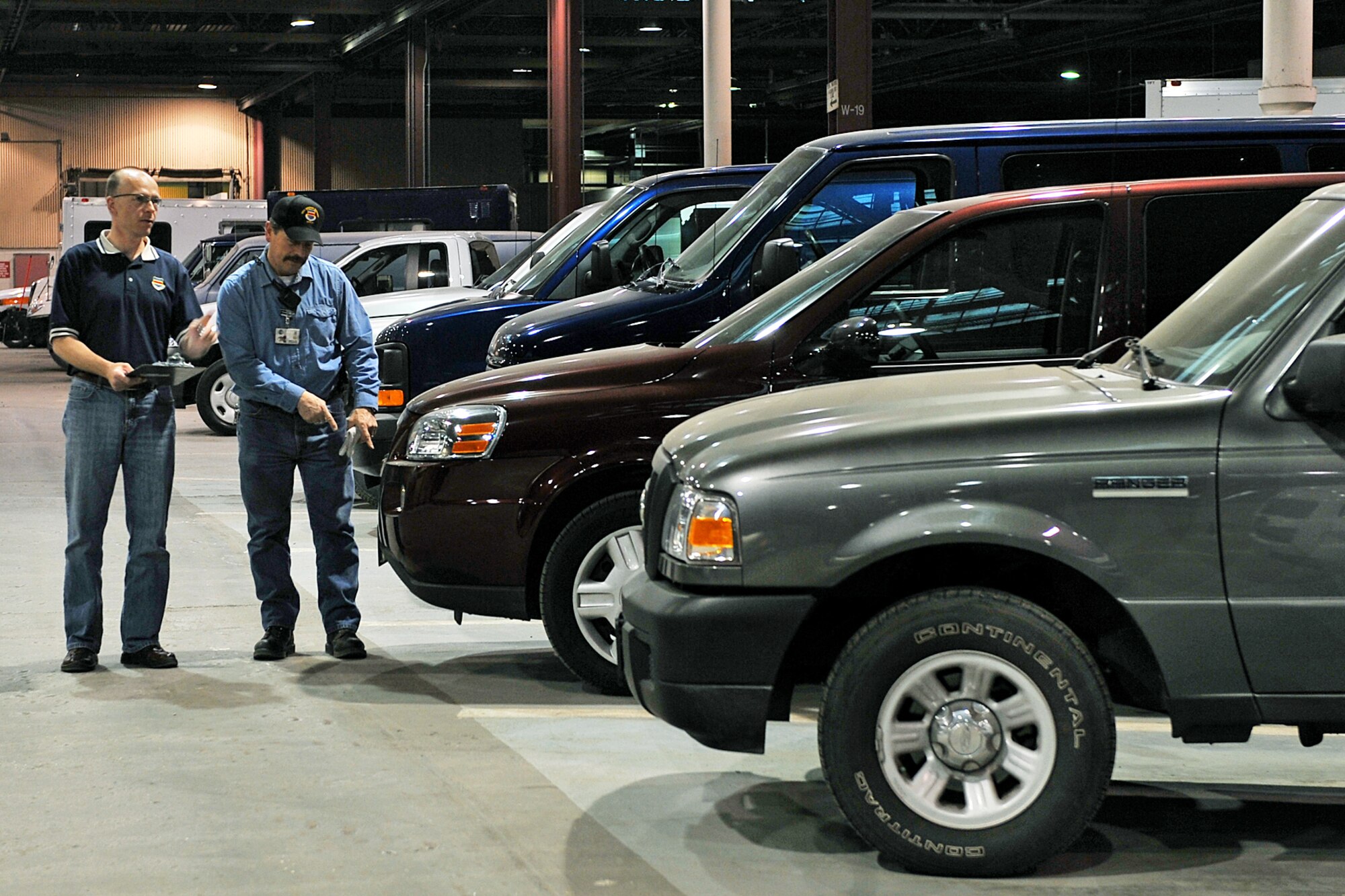 OFFUTT AIR FORCE BASE, Neb. - (From left) Chief of vehicle operations Sean Patomson and work leader Mike Wangberg, both with the 55th Mission Support Group's Logistics Support Division, conduct a vehicle inventory inside Bldg. D March 19. The division's vehicle operations section takes care of Offutt's transportation needs using a fleet of more than 60 vehicles.  

U.S. Air Force photo by Charles Haymond