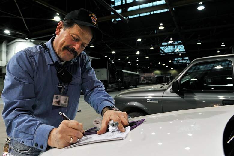 OFFUTT AIR FORCE BASE, Neb. - Mike Wangberg, work leader with the 55th Mission Support Group's Logistics Support Division, fills out a vehicle worksheet inside Bldg. D March 19. The division's vehicle operations section takes care of Offutt's transportation needs using a fleet of more than 60 vehicles.  

U.S. Air Force photo by Charles Haymond 