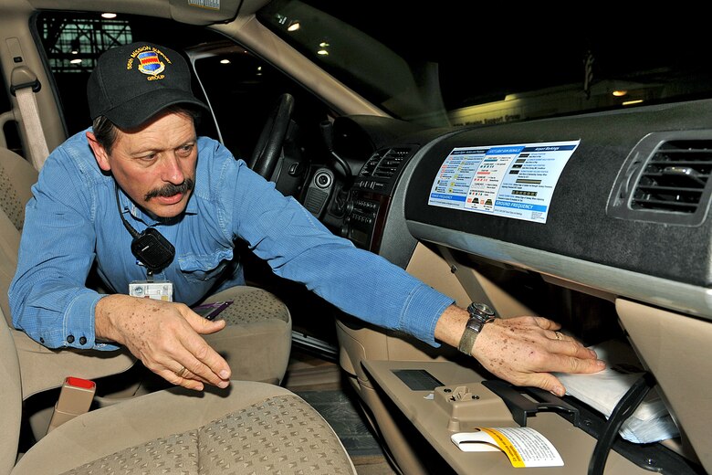OFFUTT AIR FORCE BASE, Neb. - Mike Wangberg, work leader with the 55th Mission Support Group's Logistics Support Division, inspects a vehicle inside Bldg. D March 19. The division's vehicle operations section takes care of Offutt's transportation needs using a fleet of more than 60 vehicles.  

U.S. Air Force photo by Charles Haymond