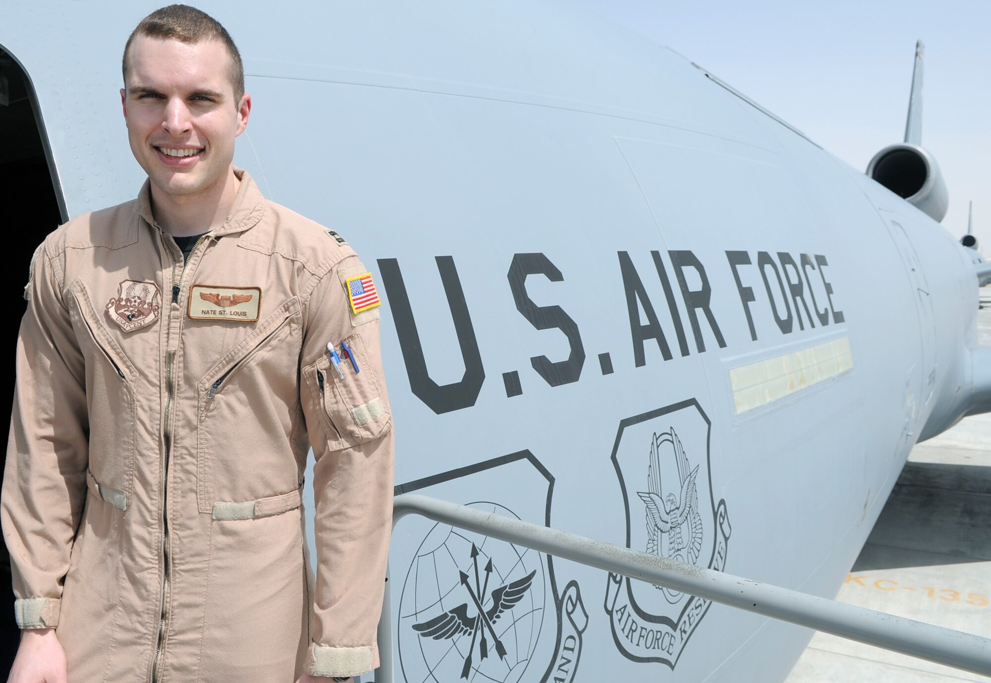 Capt. Nate St. Louis, KC-10 Extender piliot and assistant operations officer for the 908th Expeditionary Air Refueling Squadron, stands next to a KC-10 at a non-disclosed base in Southwest Asia on March 24, 2010. Captain St. Louis is deployed from the 32nd Air Refueling Squadron at Joint Base McGuire-Dix-Lakehurst, N.J., and his hometown is China Grove, N.C. (U.S. Air Force Photo/Master Sgt. Scott T. Sturkol/Released)
