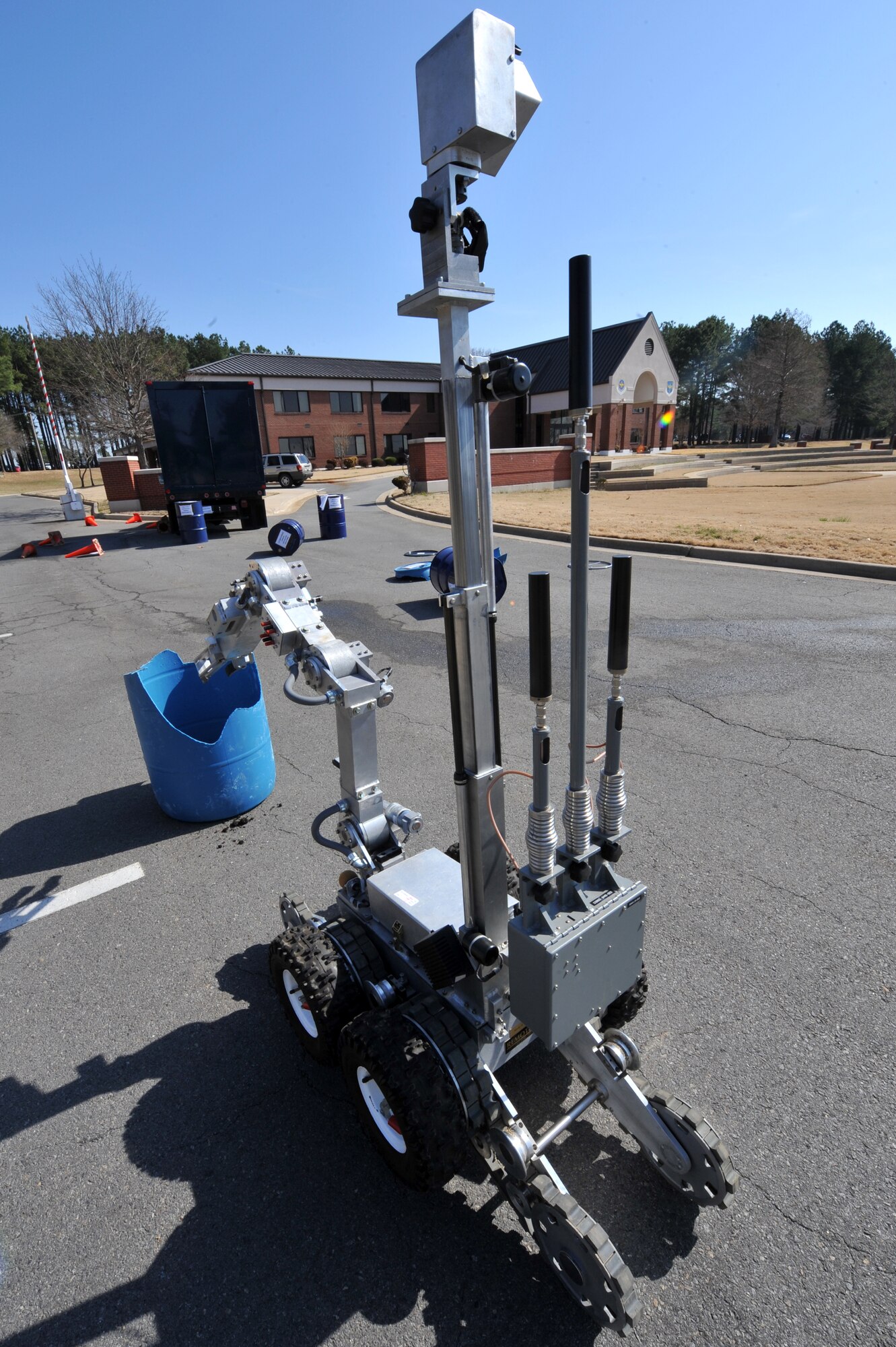 An explosive ordinance devise robot performs reconnisance March 19 on a simulated bomb placed outside of the Little Rock Air Force Base headquarters building. EOD members responded to several simulated events with other base personnel during the MARE to stay current with their training.  (U.S. Air Force Photo by Senior Airman Chris Willis)