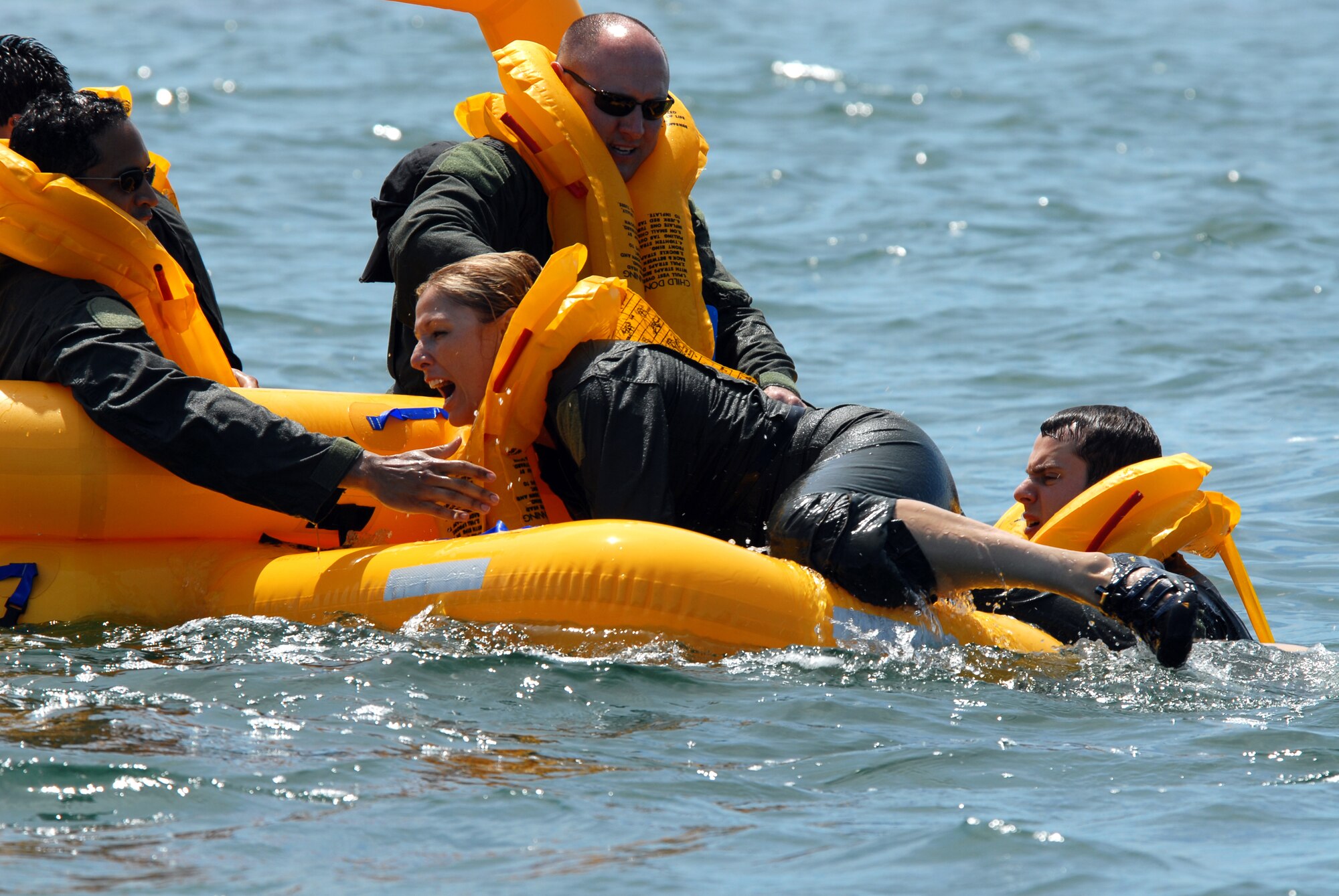 Lt. Col. April Vogel, C-38 Pilot, 201st Airlift Squadron / NGB / J-3-5, climbs into the AC9 Raft as part of water survival training at Naval Air Station Key West, Fla. Mar 15. (U.S. Air Force photo by Tech. Sgt. Tyrell Heaton/Released)