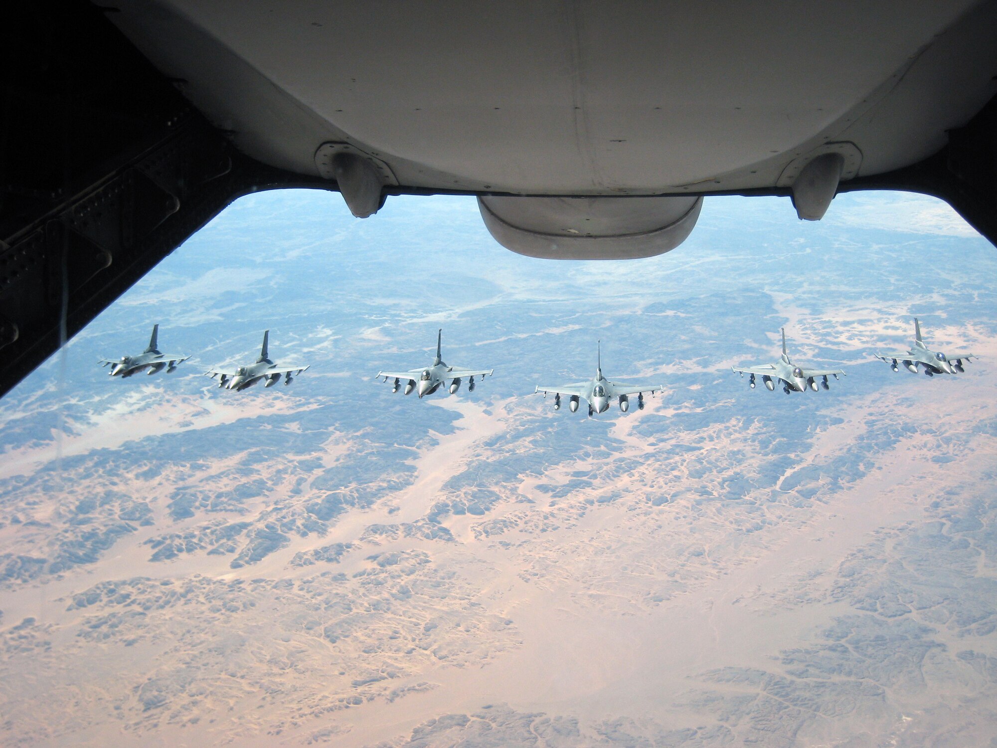 F-16 Fighting Falcons line up to be refueled by a KC-10 Extender from the 908th Expeditionary Air Refueling Squadron over Afghanistan during Operation Enduring Freedom air refueling operations in February 2010. The air refueling capability of the KC-10 in combat operations allows fighters to provide close-air support for "troops in contact" in Afghanistan and other areas of operations. The 908th EARS is part of the 380th Air Expeditionary Wing which supports operations Iraqi Freedom and Enduring Freedom and the Combined Joint Task Force-Horn of Africa. In 2009, KC-10s from the 380th AEW and the 908th EARS flew 4,760 combat sorties offl-loading 422,222,300 pounds of fuel to 31,434 aircraft. In the same year, the KC-10s and their crews accumulated 40,011 hours of flight time. (U.S. Air Force Photo/Capt. Sean Chuplis/Released)