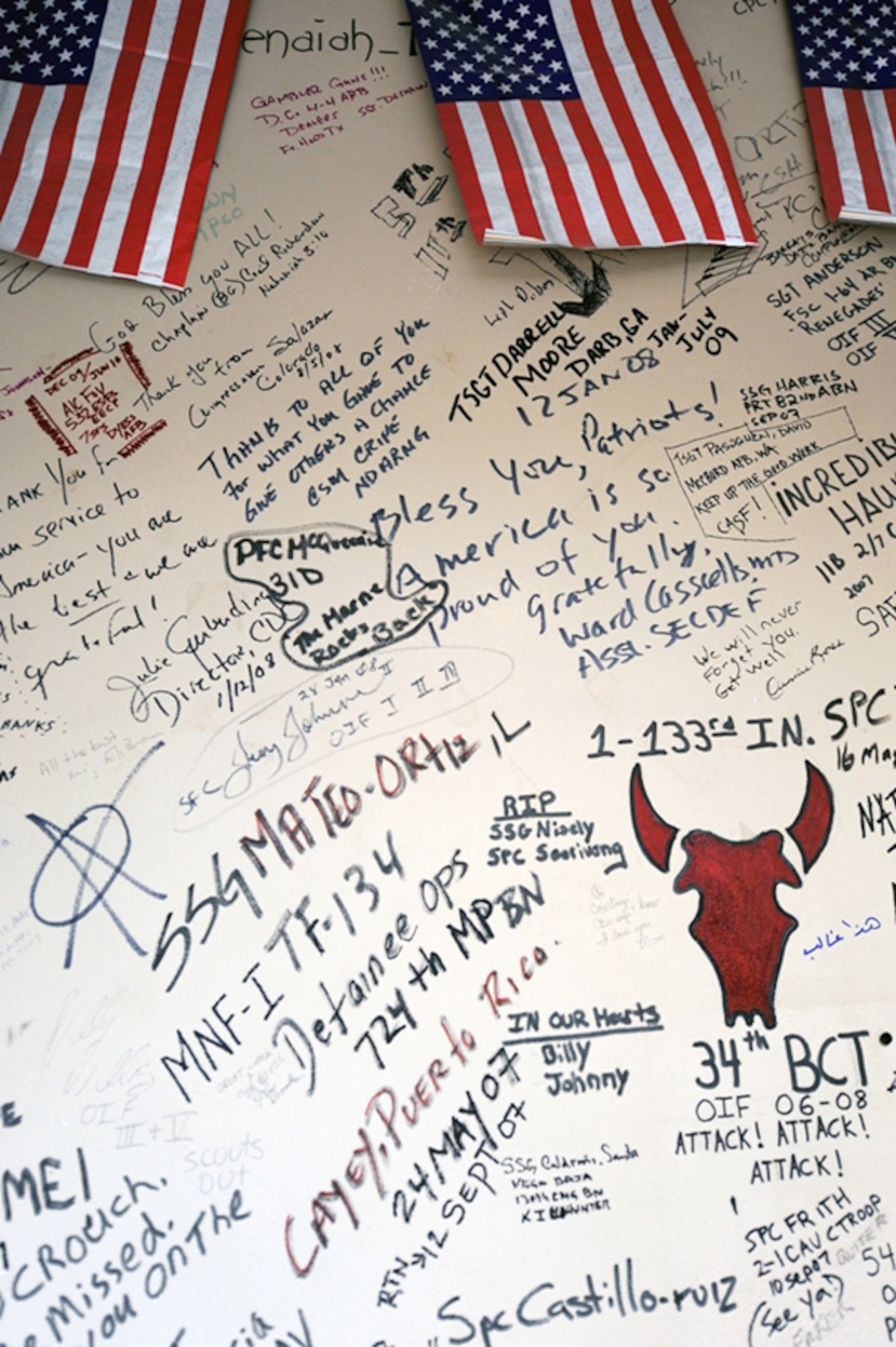 Names and messages are scribbled on the wounded warrior wall at the contingency aeromedical staging facility at Joint Base Balad, Iraq. (U.S. Air Force photo/Master Sgt. Linda C. Miller)