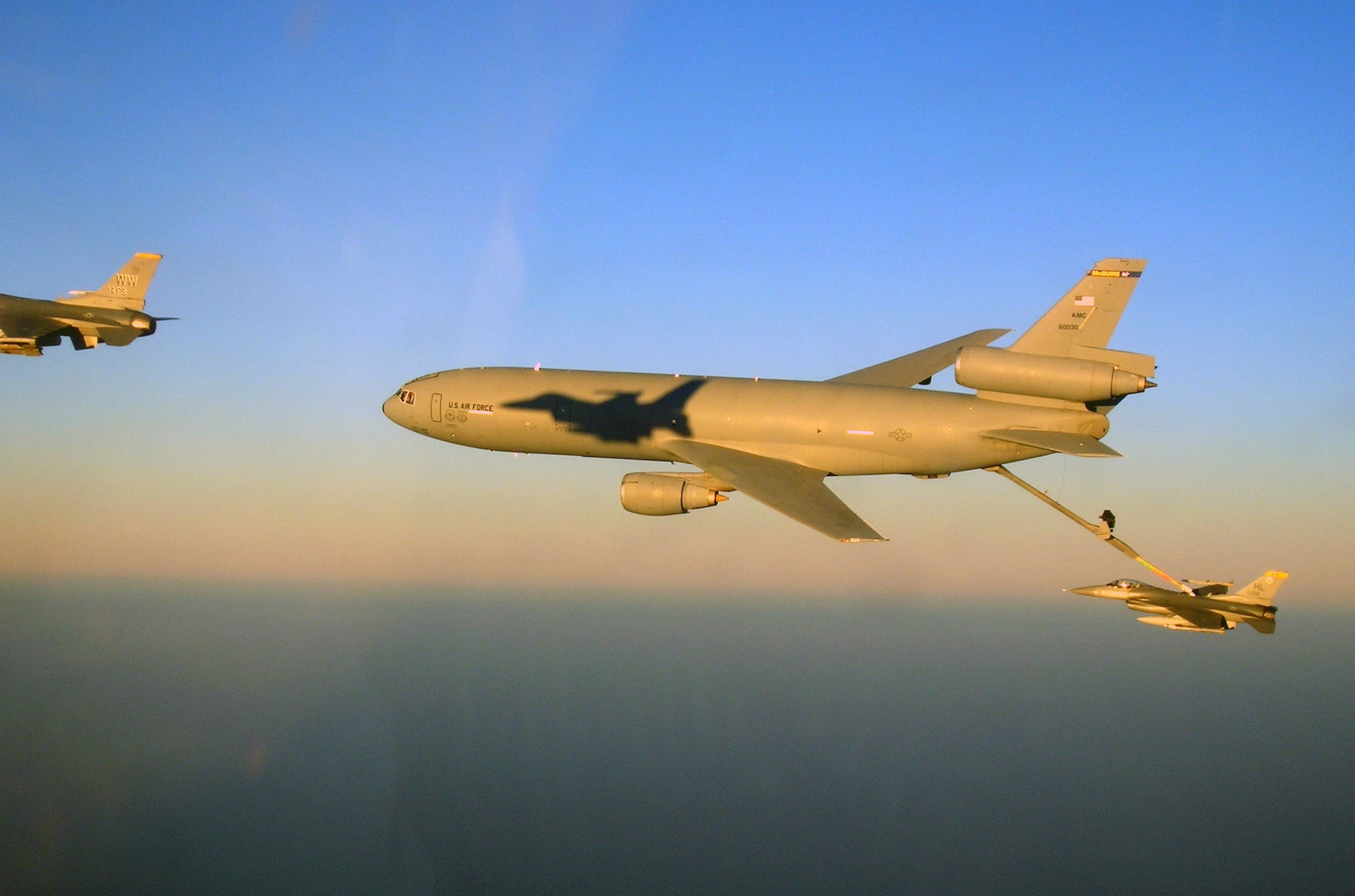 A KC-10 Extender rom the 908th Expeditionary Air Refueling Squadron refuels F-16 Fighting Falcons over Afghanistan during Operation Enduring Freedom air refueling operations in February 2010. The air refueling capability of the KC-10 in combat operations allows fighters to provide close-air support for "troops in contact" in Afghanistan and other areas of operations. The 908th EARS is part of the 380th Air Expeditionary Wing which supports operations Iraqi Freedom and Enduring Freedom and the Combined Joint Task Force-Horn of Africa. In 2009, KC-10s from the 380th AEW and the 908th EARS flew 4,760 combat sorties offl-loading 422,222,300 pounds of fuel to 31,434 aircraft. In the same year, the KC-10s and their crews accumulated 40,011 hours of flight time. (U.S. Air Force Photo/Capt. Sean Chuplis/Released)