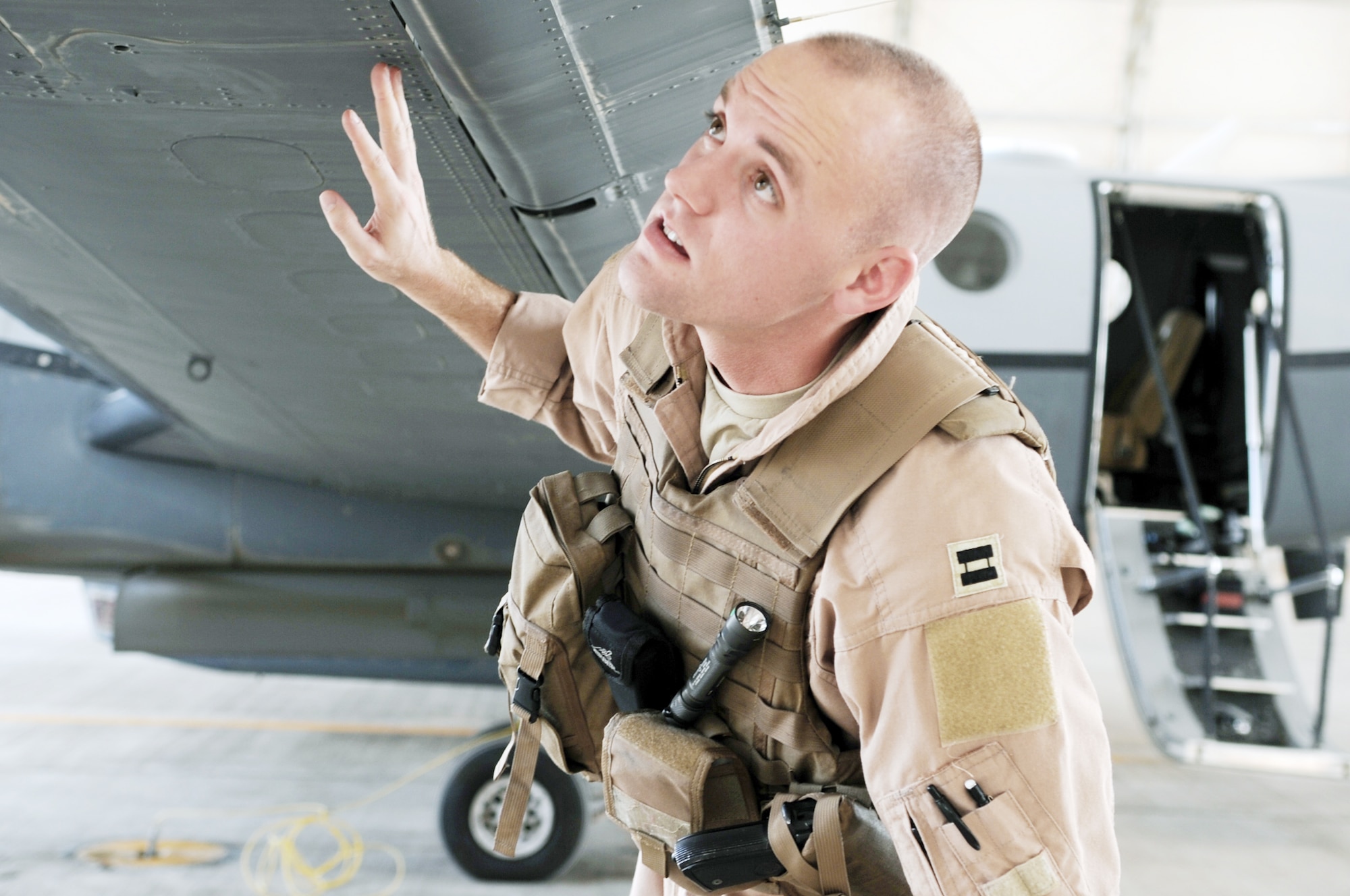Capt. Ryan Woodman visually inspects an MC-12 Liberty prior to flight March 11, 2010, at Joint Base Balad, Iraq. Captain Woodman a pilot with the 362nd Expeditionary Reconnaissance Squadron. (U.S. Air Force photo/Senior Airman Brittany Y. Bateman)
