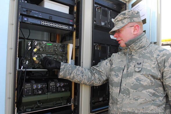 Staff Sgt. Jeff Lansca, Communications Squadron, 148th Fighter Wing makes a few radio adjustments on the Remote Communications Platform used to support the spring flood fighting operations in Moorhead, Minn. Mar. 20.