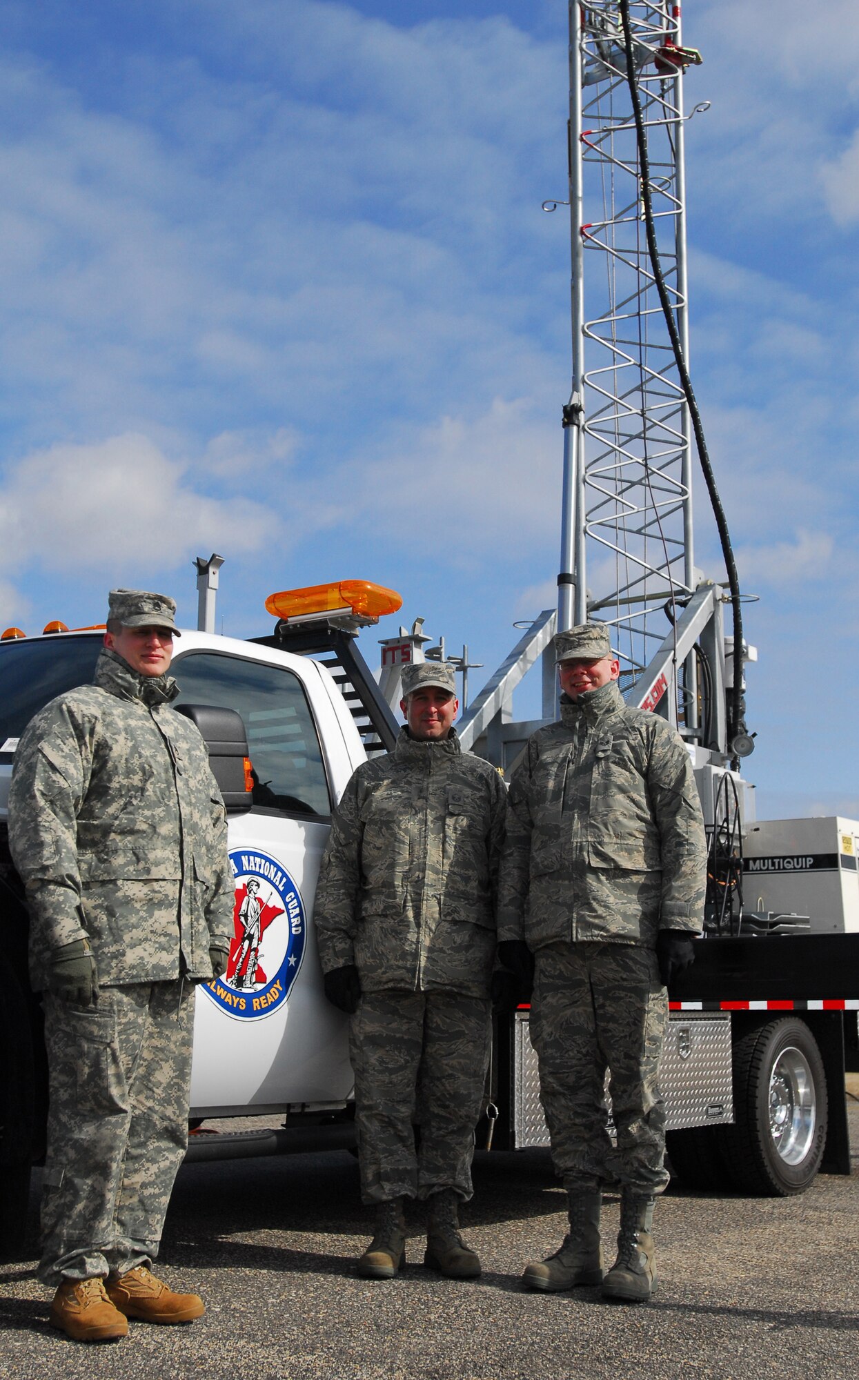 Minnesota National Army and Air National Guard members form a joint team to operate and maintain the Remote Communications Platform deployed to Moorhead in support of local authorities battling spring floods. The team is (l-r) Staff Sgt. Troy Tretter, D Co., 1-194 Combined Arms Battalion, Master Sgt. Bryan Druer and Staff Sgt. Jeff Lansca, Communications Squadron, 148th Fighter Wing.