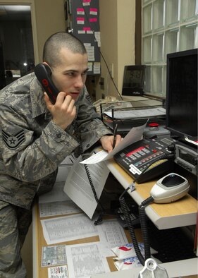 MINOT AIR FORCE BASE, N.D. -- Staff Sgt. Jason Slajchert, 5th Medical Operations Squadron medical technician, writes down all essential information during a 911 call at Minot AFB March 17. Members of ambulance services work both twelve- and twenty-four hour shifts and stay prepared to respond to all emergencies. (U.S. Air Force photo by Airman 1st Class Ashley N. Avecilla)