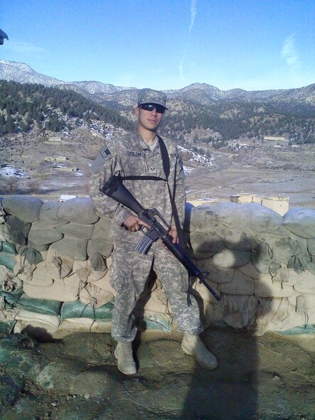 ON THE AFGHANISTAN-PAKISTAN BORDER -- Staff Sgt. Aaron Toledo, 5th Communications Squadron network infrastructure technician, poses for the camera at the Spera Combat Outpost during his 2009 deployment this past winter. (Courtesy photo)