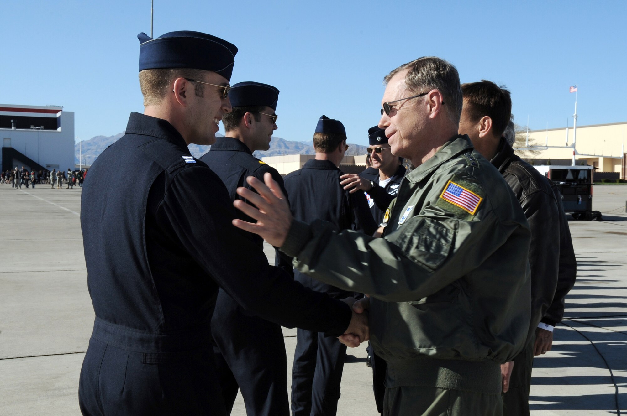 Gen. William M. Fraser III meets Capt. Paul Jelinek following the team's acceptance show March 11, 2010, at Nellis Air Force Base, Nev. General Fraser is the commander of Air Combat Command, and Captain Jelinek is the Air Force Air Demonstration Squadron "Thunderbirds" opposing solo pilot. (U.S. Air Force photo/Staff Sgt. Richard Rose)