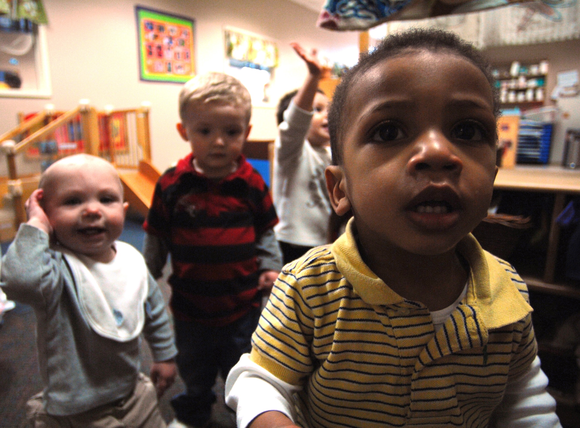 Dorian Hair and classmates attending the Ramstein Air Base Child Development Center pose for a photo Feb. 23, here. June marks the scheduled opening of the new the $5.1 million child development center facility which will open 112 childcare slots on Ramstein. (U.S. Air Force photo by Tech. Sgt. Michael Voss)
