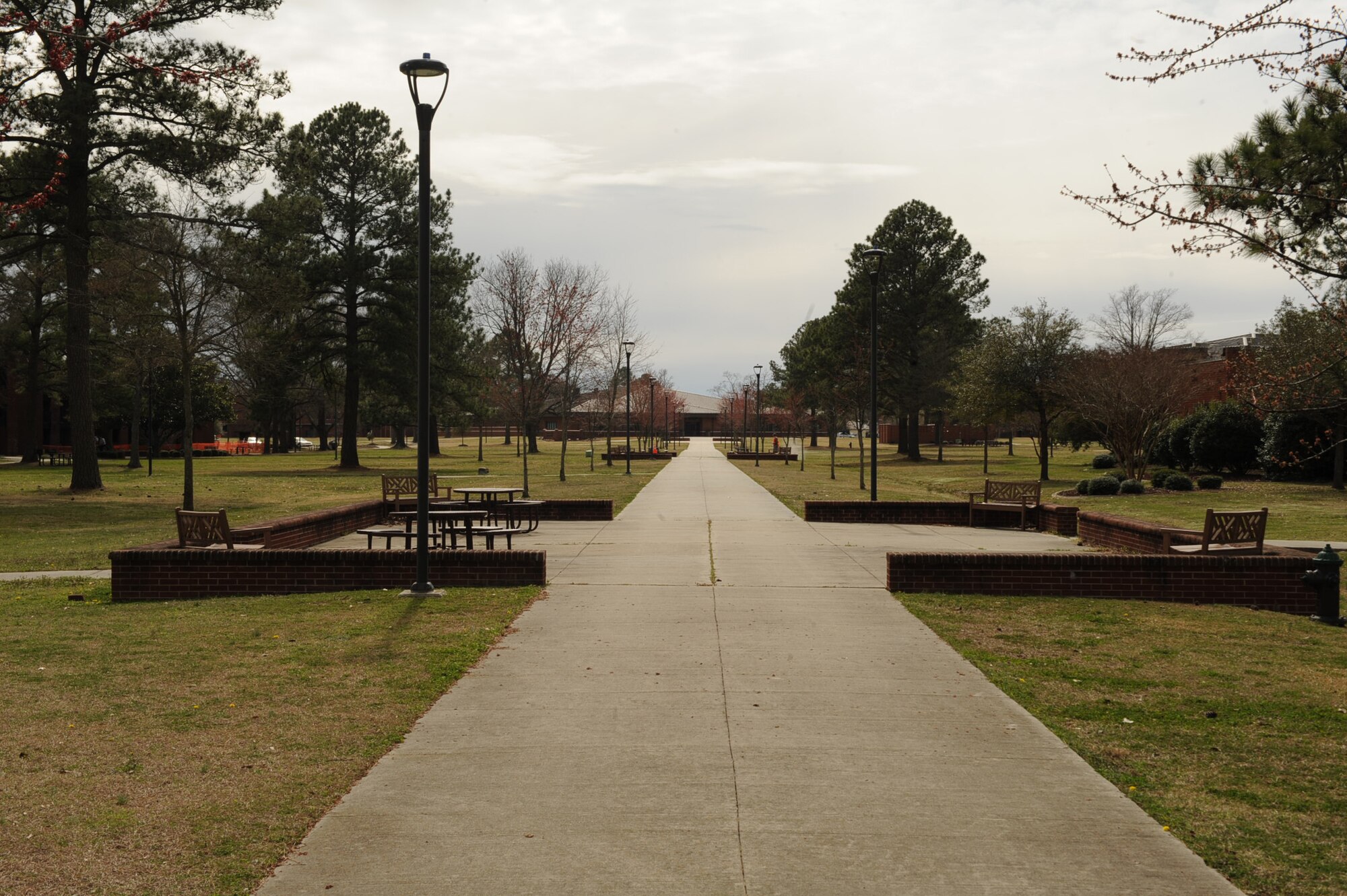 Open spaces like this provide common areas for dormitory Airmen to mingle on Seymour Johnson Air Force Base, N.C. This dormitory complex pavilion is located in the center of 10 dormitory buildings. It leads straight to the dining facility and is within close proximity of the base exchange and commissary. (U.S. Air Force photo/Senior Airman Ciara Wymbs)  