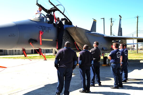 Members of the Goldsboro Fire Department take turns examining the F-15E Strike Eagle cockpit as Michael Blackburn, 4th Civil Engineer Squadron fire department special operations officer, explains its features on Seymour Johnson Air Force Base, N.C., March 19, 2010. Aircraft familiarization training provides local emergency responders an up-close look at the airframes and knowledge of hazards associated with it. Blackburn hails from Beulaville, N.C. (U.S. Air Force photo/Senior Airman Rae Perry)