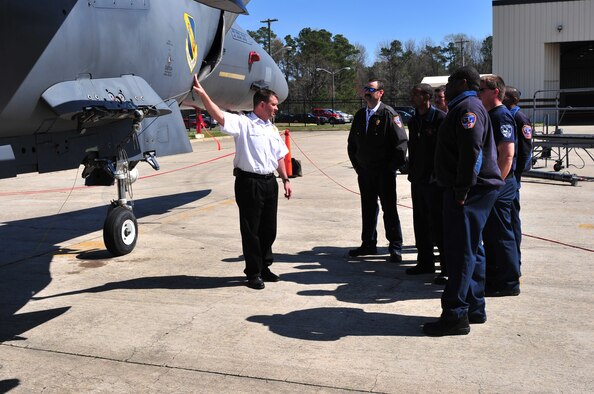 Michael Blackburn, 4th Civil Engineer Squadron fire department special operations officer, shows members of the Goldsboro Fire Department potential F-15E Strike Eagle areas that could cause a hazard during a real world-response as part of aircraft familiarization training on Seymour Johnson Air Force Base, N.C., March 19, 2010. During the training, Wayne County and Goldsboro firefighters learned proper response actions for an incident involving hydraulic fluids, fuel, oxygen and a downed aircraft, all of which are not part of their standard training. Blackburn hails from Beulaville, N.C. (U.S. Air Force photo/Senior Airman Rae Perry)