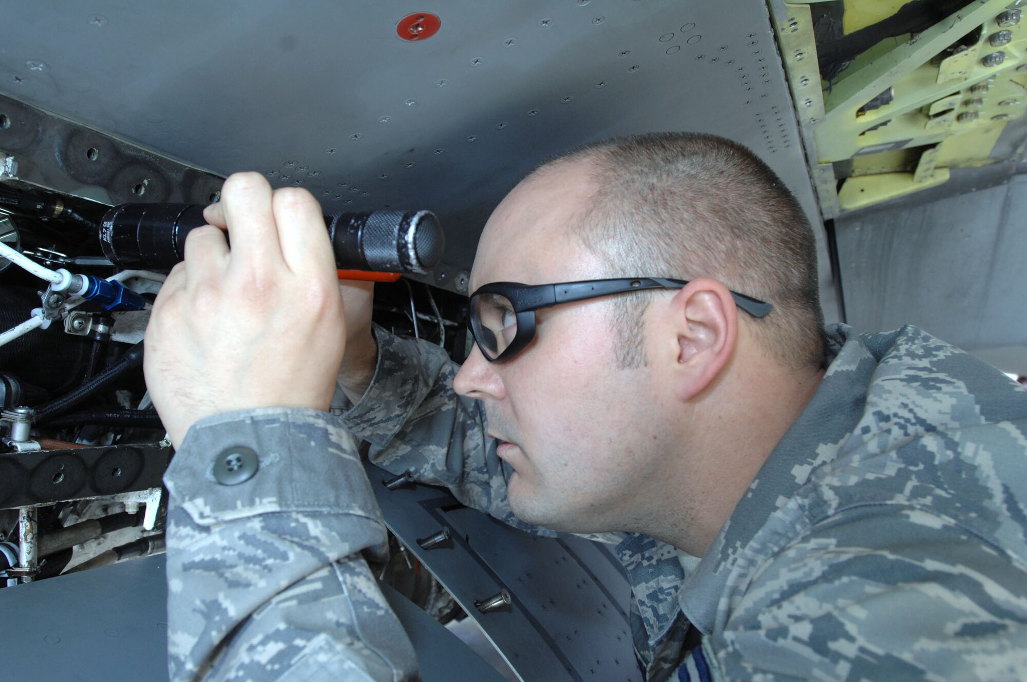Tech. Sgt. Derek J. Bibber, 31st Maintenance Squadron Inspection Section assistant chief, inspects an F-16 Fighting Falcon’s environmental control system's pneumatic tubing. Sergeant Bibber recently received the Lieutenant General Leo Marquez Award for the Supervisor and Technician category. The Lieutenant General Leo Marquez Award is presented to maintainers who have demonstrated the highest degree of sustained job performance, job knowledge, job efficiency and results in the categories of aircraft, munitions/missile and communications-electronics maintenance. (U.S. Air Force photo/Staff Sgt. Julius Delos Reyes)