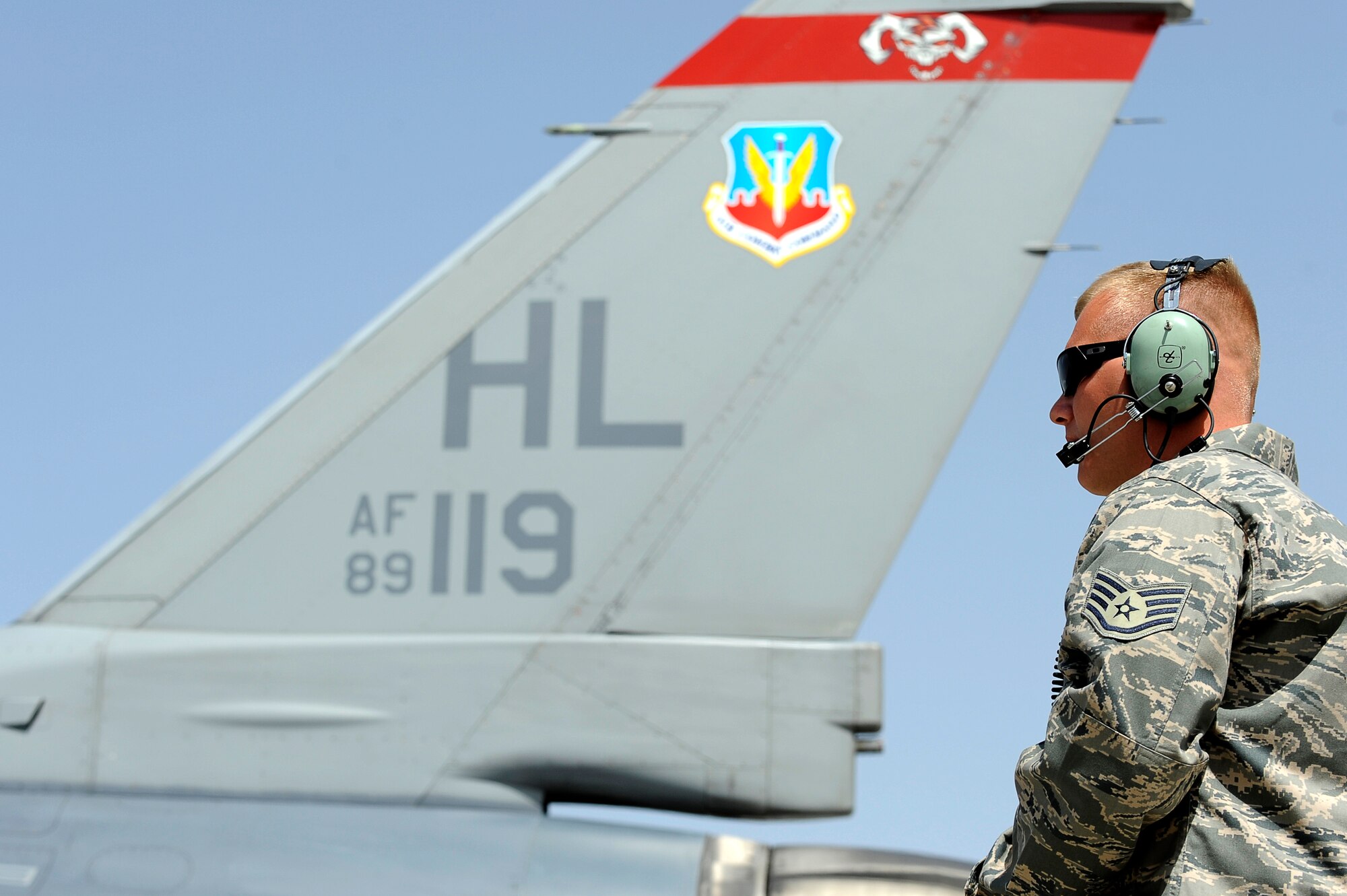 U.S. Air Force Staff Sgt. Lucas Inboden, 34th Expeditionary Fighter Squadron, recovers an F-16 at Bagram Airfield, Afghanistan, after the aircraft completed 30 code 1 flights, March 23, 2010. Sergeant Inboden is deployed from Hill Air Force Base, Utah, and is from Dallas, Texas. (U.S. Air Force photo by/ Tech. Sgt. Jeromy K. Cross/released)