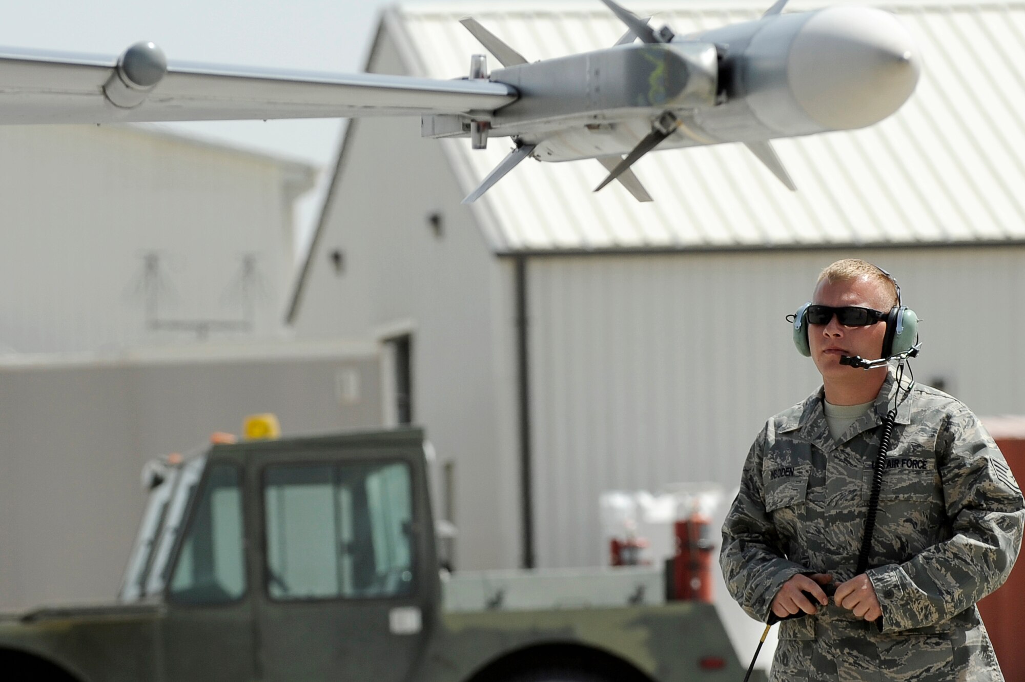 U.S. Air Force Staff Sgt. Lucas Inboden, 34th Expeditionary Fighter Squadron, recovers an F-16 at Bagram Airfield, Afghanistan, after the aircraft completed 30 code 1 flights, March 23, 2010. Sergeant Inboden is deployed from Hill Air Force Base, Utah, and is from Dallas, Texas. (U.S. Air Force photo by/ Tech. Sgt. Jeromy K. Cross/released)