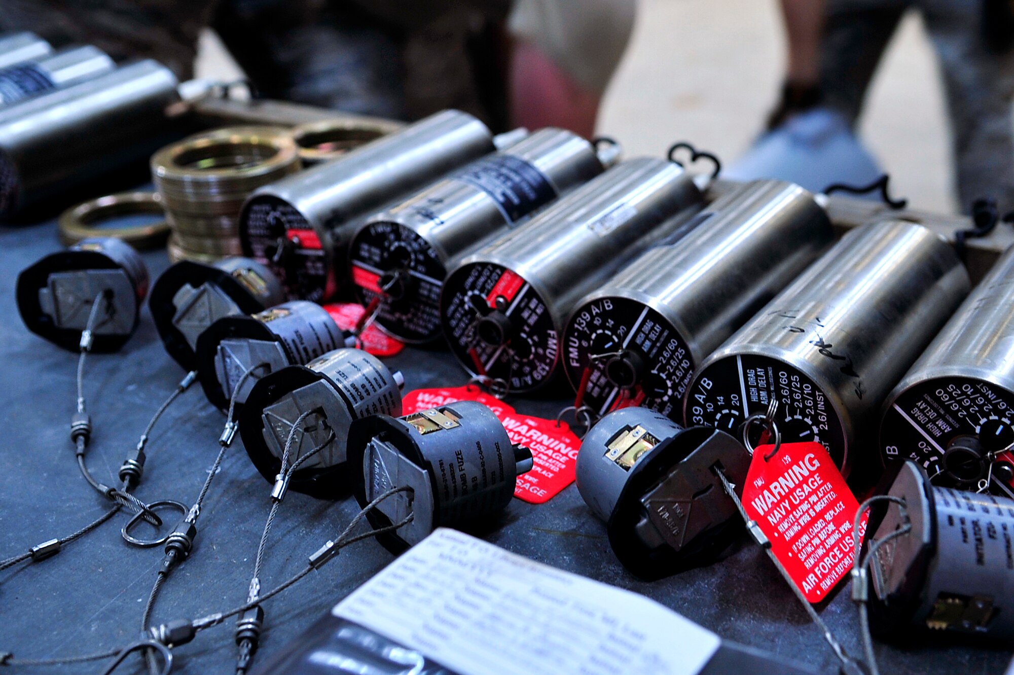 Airmen from the 18th Munitions Squadron place fuses in Mark 83 bomb bodies during Beverly High 10-02 at Kadena Air Base, Japan, March 24. The 18th Wing is participating in a Local Operational Readiness Exercise March 22-26 to test the readiness of Kadena Airmen. (U.S. Air Force photo/Senior Airman Amanda Grabiec)    