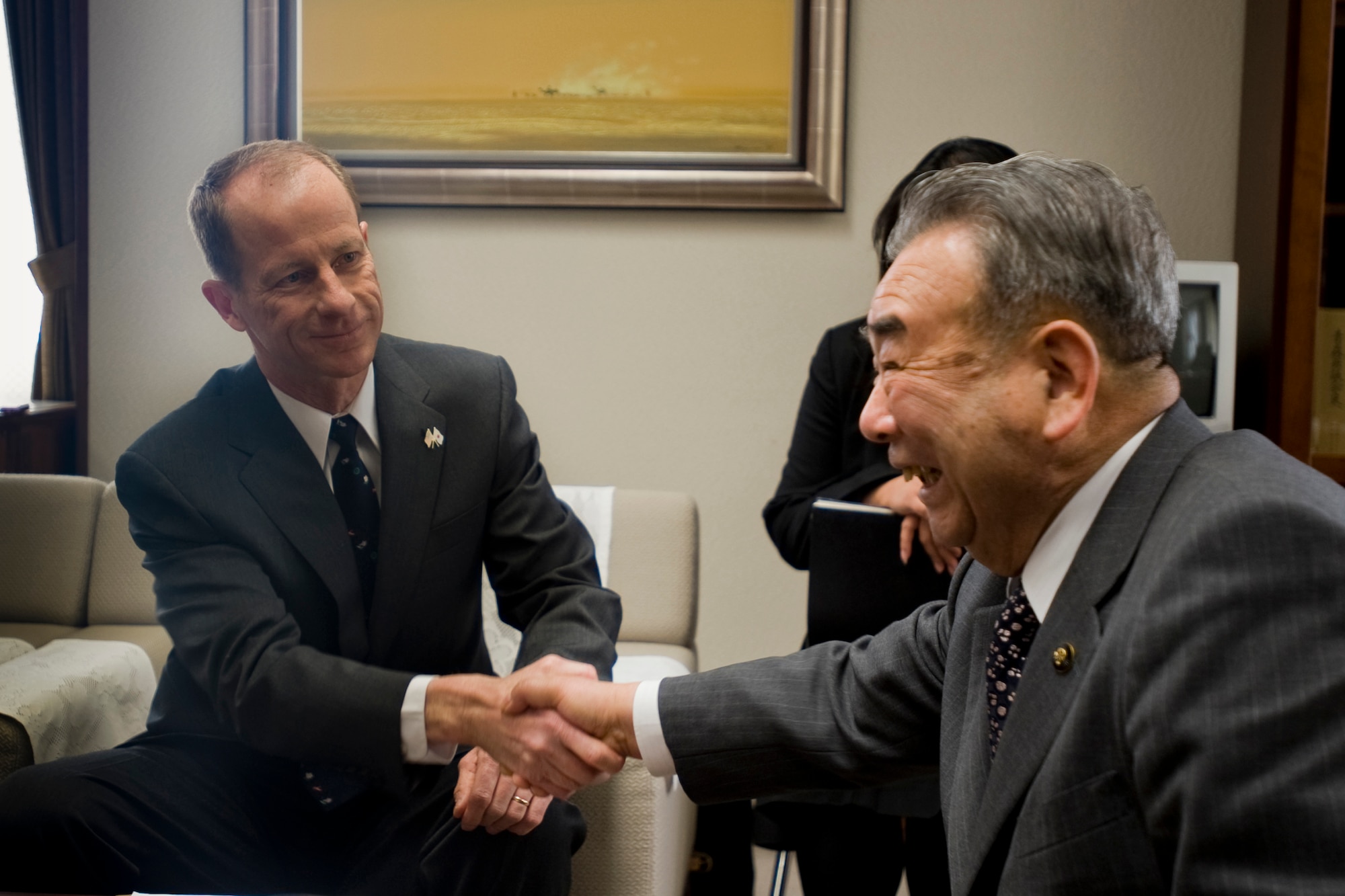 MISAWA CITY, Japan -- Col. David Stilwell, 35th Fighter Wing commander and Misawa City Mayor Kazumasa Taneichi shake hands during the Misawa Mayor for a Day event March 23 at the mayor's office. The event, which is a tradition at Misawa, created an opportunity to further promote an understanding of international exchange and goodwill between Misawa City and Misawa Air Base. (U.S. Air Force photo/Senior Airman Jamal D. Sutter)