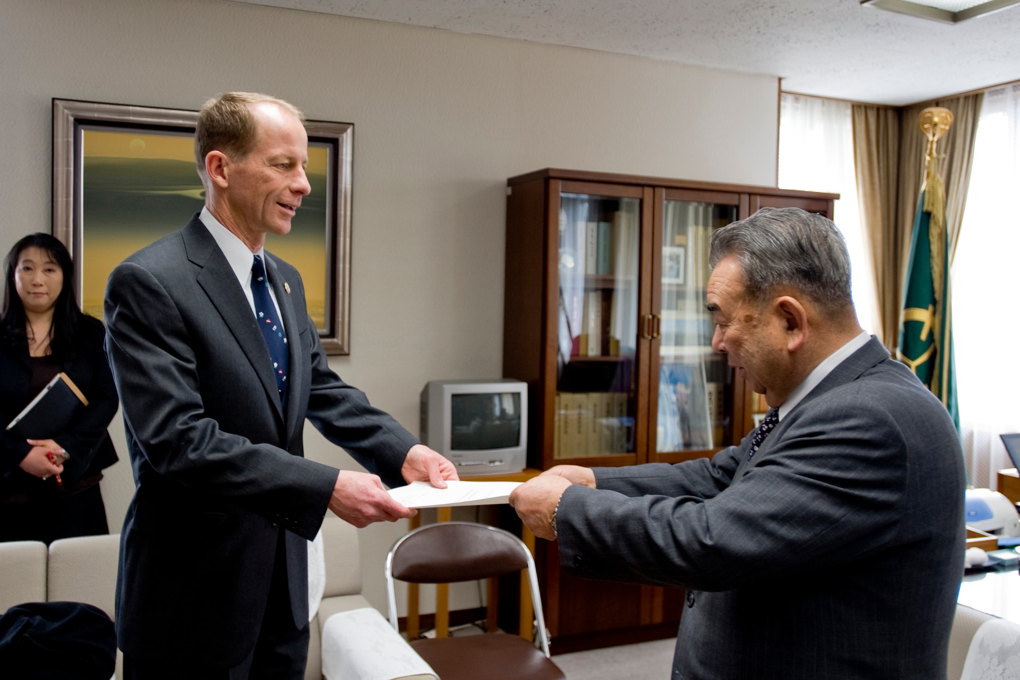 MISAWA CITY, Japan -- Col. David Stilwell, 35th Fighter Wing commander, receives a letter of appointment from Misawa City Mayor Kazumasa Taneichi during the Misawa Mayor for a Day event March 23 at the mayor's office. The letter officially appointed Colonel Stilwell as the honorary mayor of Misawa City for the day. (U.S. Air Force photo/Senior Airman Jamal D. Sutter)