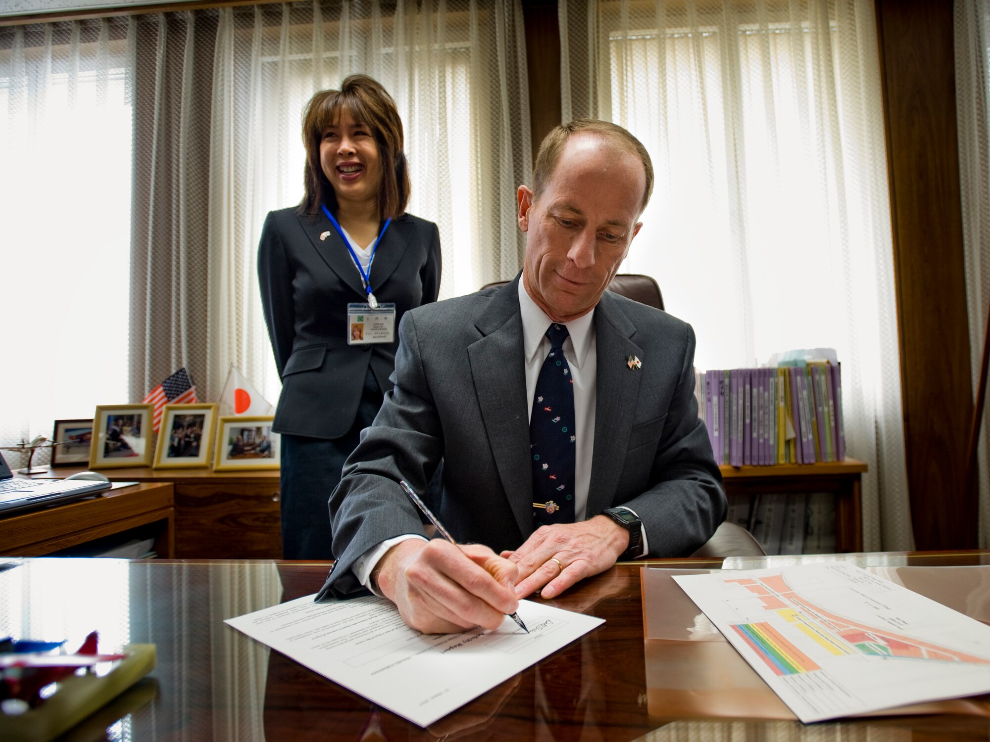 MISAWA CITY, Japan -- Col. David Stilwell, 35th Fighter Wing commander and honorary Mayor of Misawa City, approves a staff report March 23 during the Misawa Mayor for a Day event. Through meeting new people and touring Misawa City Hall, Colonel Stilwell was given an opportunity to better understand how Misawa City conducts business. (U.S. Air Force photo/Senior Airman Jamal D. Sutter)