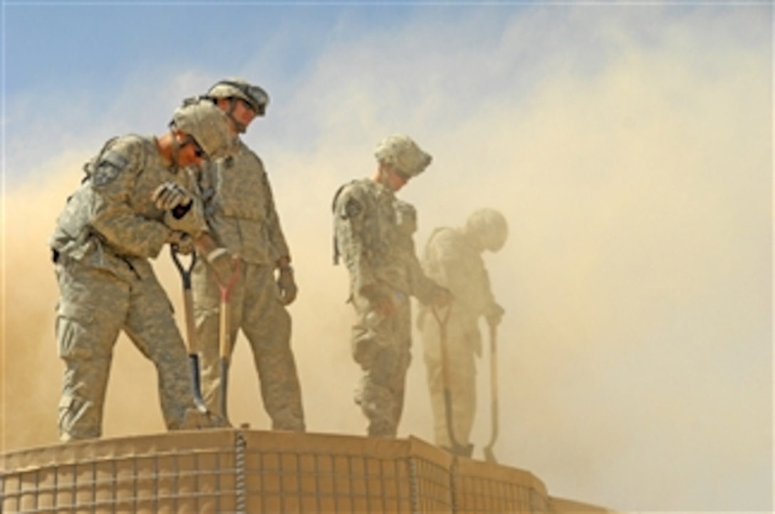 U.S. Army soldiers from the 5th Stryker Brigade Combat Team, 2nd Infantry Division construct an Afghan Highway Police checkpoint in Robat, Afghanistan, on March 19, 2010.  