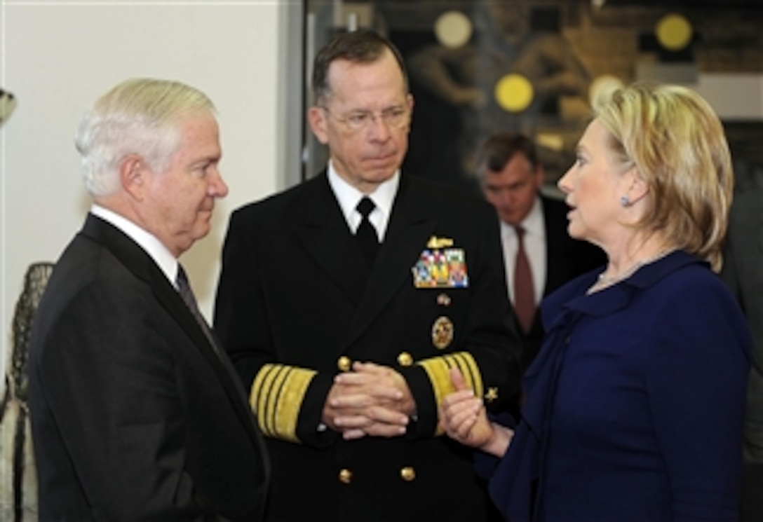 Secretary of Defense Robert M. Gates, Chairman of the Joint Chiefs of Staff Adm. Mike Mullen and Secretary of State Hillary Clinton talk during a visit to Mexico City, Mexico, on March 23, 2010.  Gates, Mullen and Clinton attended the Merida Initiative Plenary, which focuses on helping the Mexican government fight drug-trafficking cartels and other security threats.  