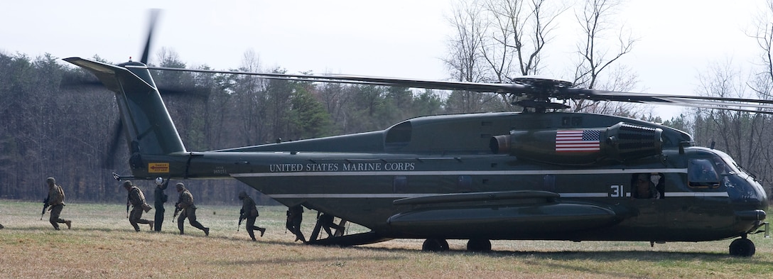 Marines from Company A, Marine Barracks Washington, board a CH-53E Super Stallion heavy lift helicopter during a training exercise at Marine Corps Base Quantico, Va., March 24.
