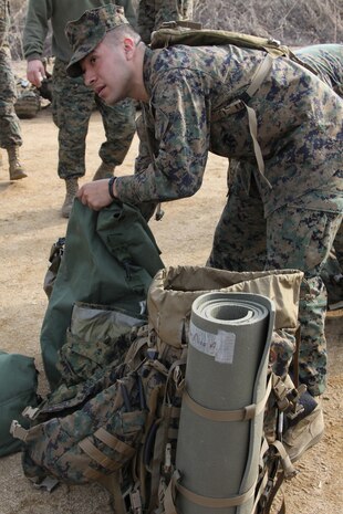 Lance Cpl. Nico Esparza, Combat Logistics Company 36 heavy equipment operator, sorts through his gear upon arrival at the billeting site for Exercise Foal Eagle 2010 on March 24. CLC-36 is scheduled to support the exercise until May 15.