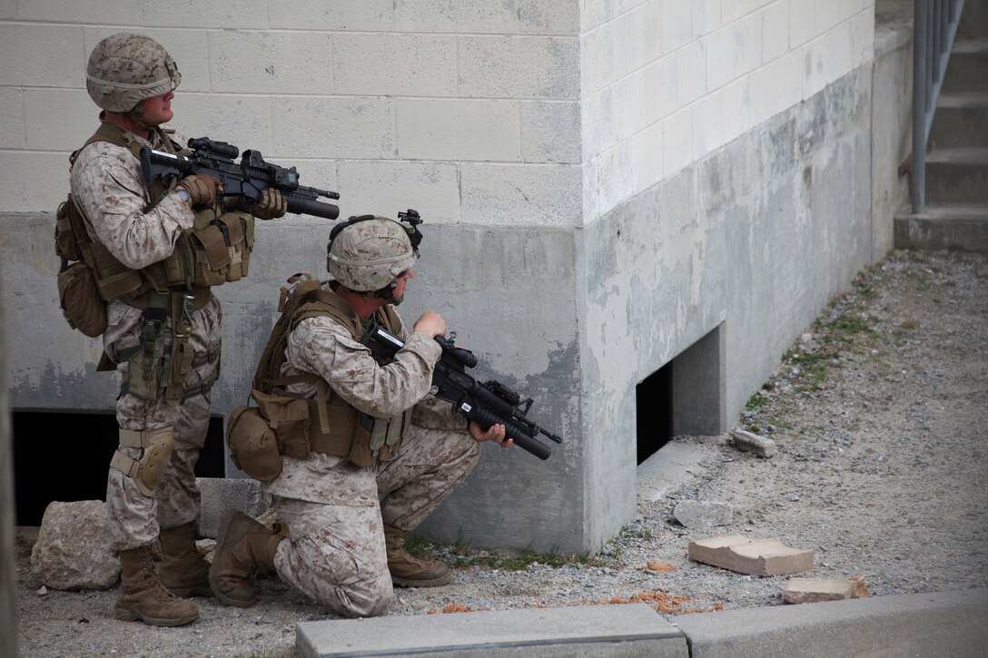 Marine with Battalion Landing Team 3/8, Light Armor Reconnaissance (LAR) platoon, practice patrolling streets in an urban environment at the Military Operations in Urban Training (MOUT) facility aboard Ft. Pickett, Va., March 25, 2010. The 26th MEU, which consists of Battalion Landing Team 3/8, Combat Logistics Battalion 26, and Marine Medium Tiltrotor Squadron 266, will spend the next six months training for its upcoming deployment. (Official United States Marine Corps Photo by Cpl. Jesse J. Johnson) (Released)::r::::n::