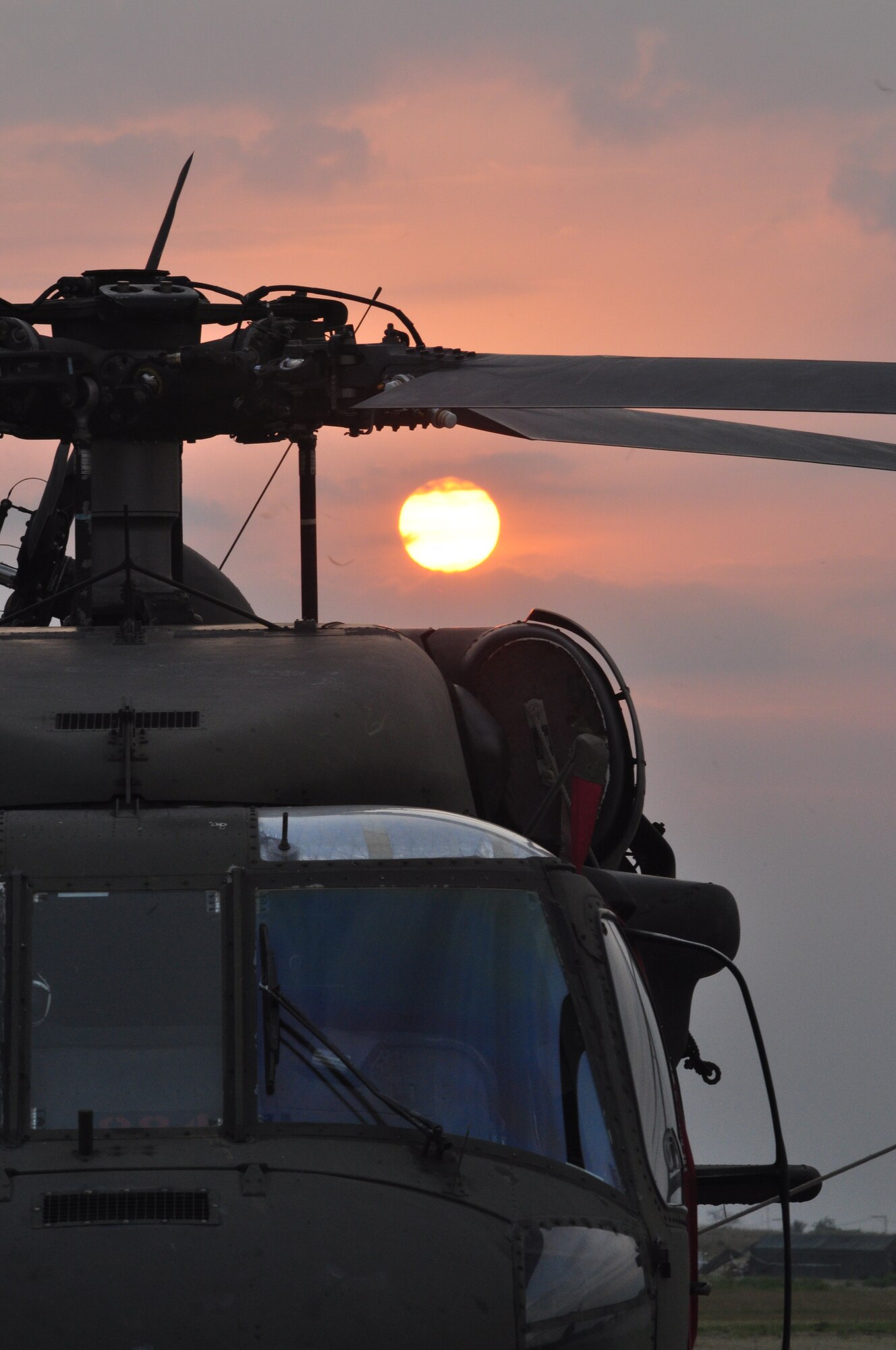 Sun sets on Joint Task Force-Bravo’s home on the flightline at Toussaint Louverture International Airport March 24 here after JTF-Bravo condcuted their first operation in support of Joint Task Force Hait, U.S. military support unit for Operation Unified Response. (U.S. Air Force photo/Staff Sgt. Bryan Franks)