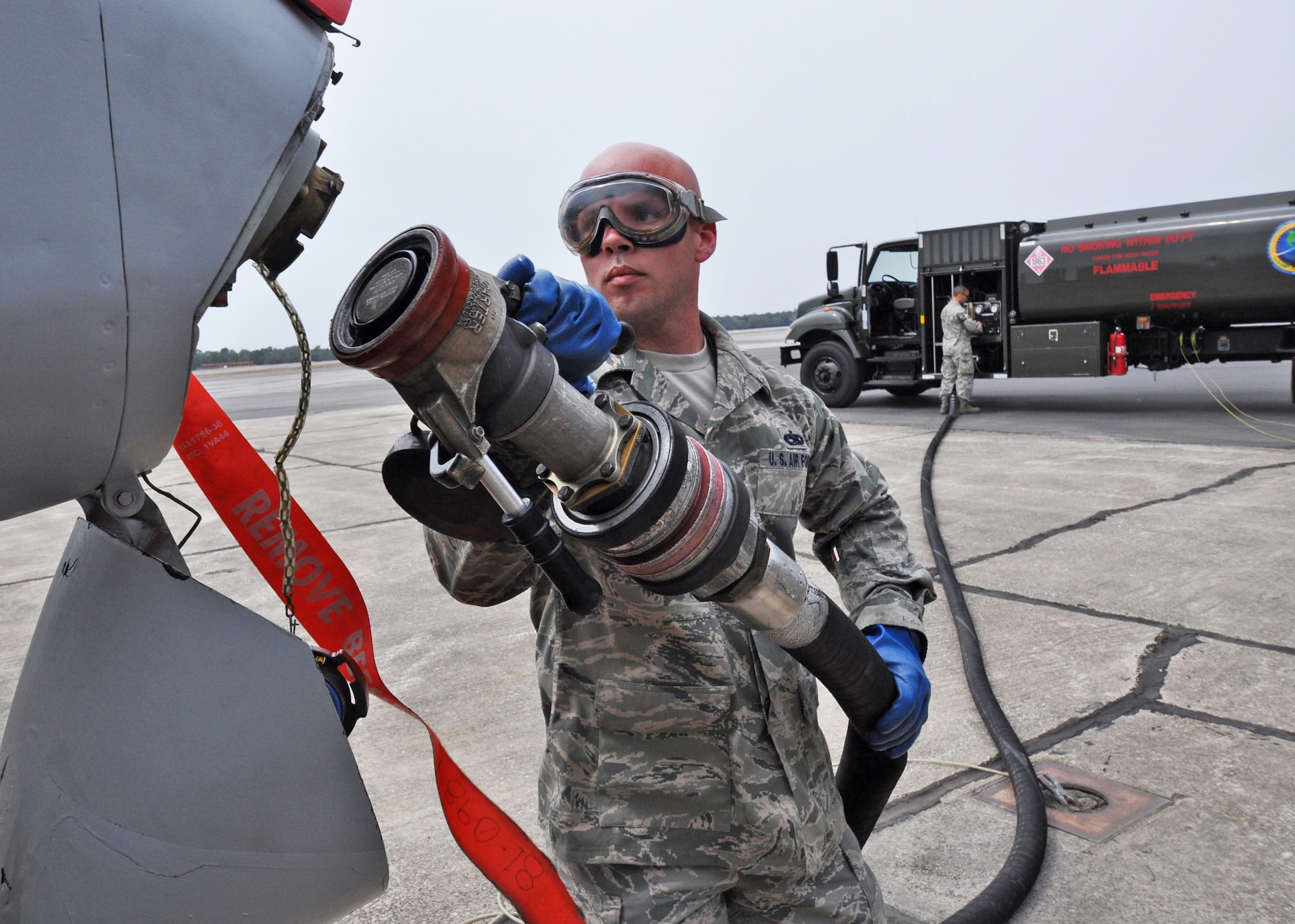 Staff Sgt. Rusty Jones prepares to fuel an A-10C Thunderbolt II March 25, 2010, with a 50/50 blend of Hydrotreated Renewable Jet and JP-8.  The A-10 then flew what was the first flight of an aircraft powered solely by a biomass-derived jet fuel blend. (U.S. Air Force photo/Samuel King Jr.)