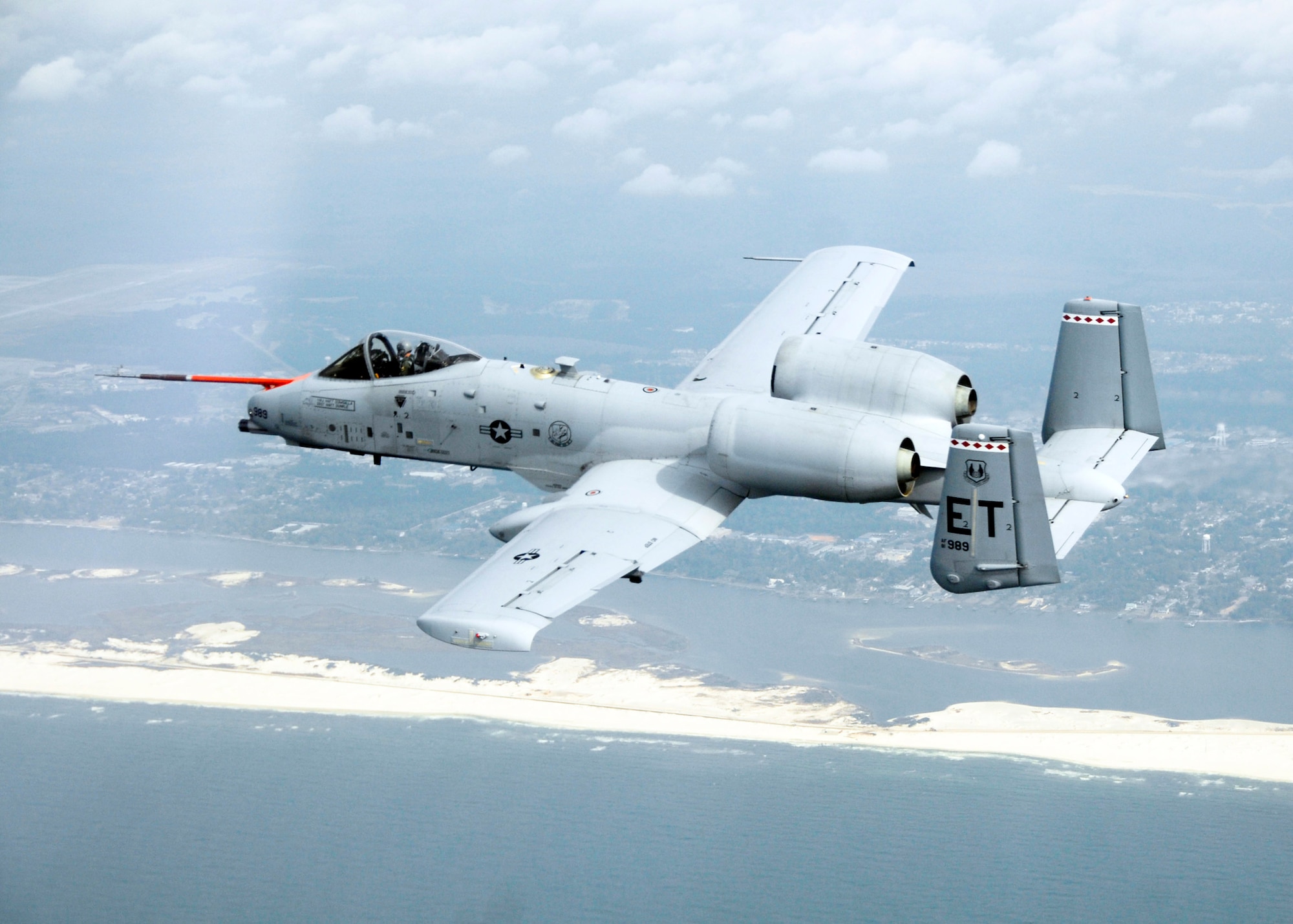 An A-10C Thunderbolt II from Eglin Air Force Base, Fla., flies along the coast of Florida March 25, 2010, during the first flight of an aircraft powered solely by a biomass-derived jet fuel blend. The A-10 was fueled with a 50/50 blend of Hydrotreated Renewable Jet and JP-8.  (U.S. Air Force photo/Senior Master Sgt. Joy Josephson)