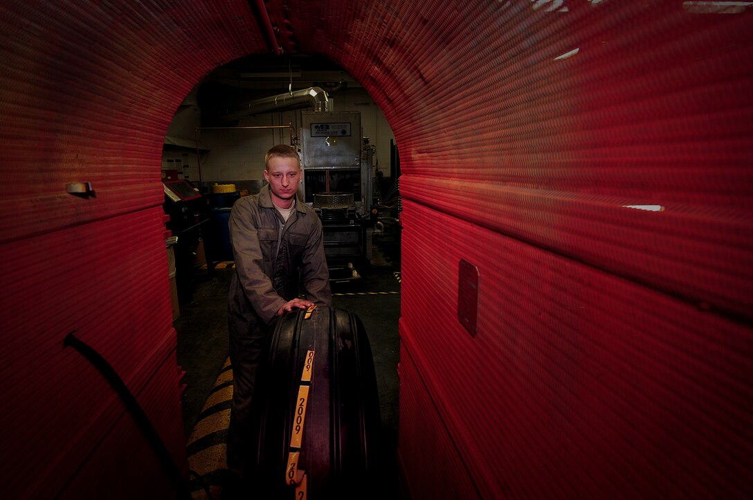 ELLSWORTH AIR FORCE BASE, S.D. -- Senior Airman Caleb Christian, 28th Maintenance Squadron repair and reclamation journeyman, prepares to inflate a B-1B Lancer tire, March 24. The main tires on a B-1 are inflated to 260 pounds per square inch. (U.S. Air Force photo/Airman 1st Class Joshua J. Seybert)