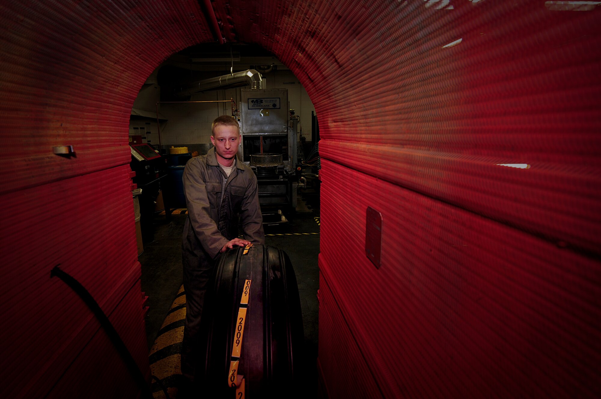 ELLSWORTH AIR FORCE BASE, S.D. -- Senior Airman Caleb Christian, 28th Maintenance Squadron repair and reclamation journeyman, prepares to inflate a B-1B Lancer tire, March 24. The main tires on a B-1 are inflated to 260 pounds per square inch. (U.S. Air Force photo/Airman 1st Class Joshua J. Seybert)