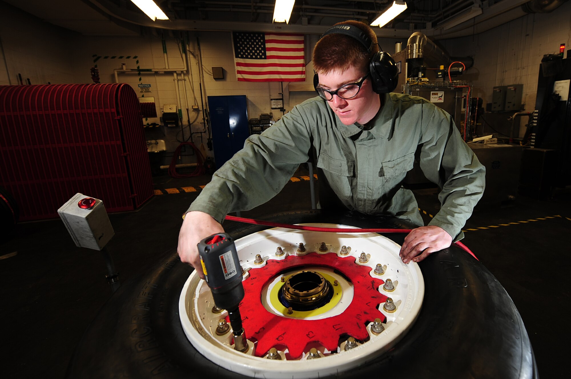 ELLSWORTH AIR FORCE BASE, S.D. -- Airman 1st Class Max Nelson, 28th Maintenance Squadron repair and reclamation apprentice, tightens bolts on a B-1B Lancer tire, March 24. On average, it takes approximately 40-minutes to completely tear down and rebuild a tire. (U.S. Air Force photo/Airman 1st Class Joshua J. Seybert)