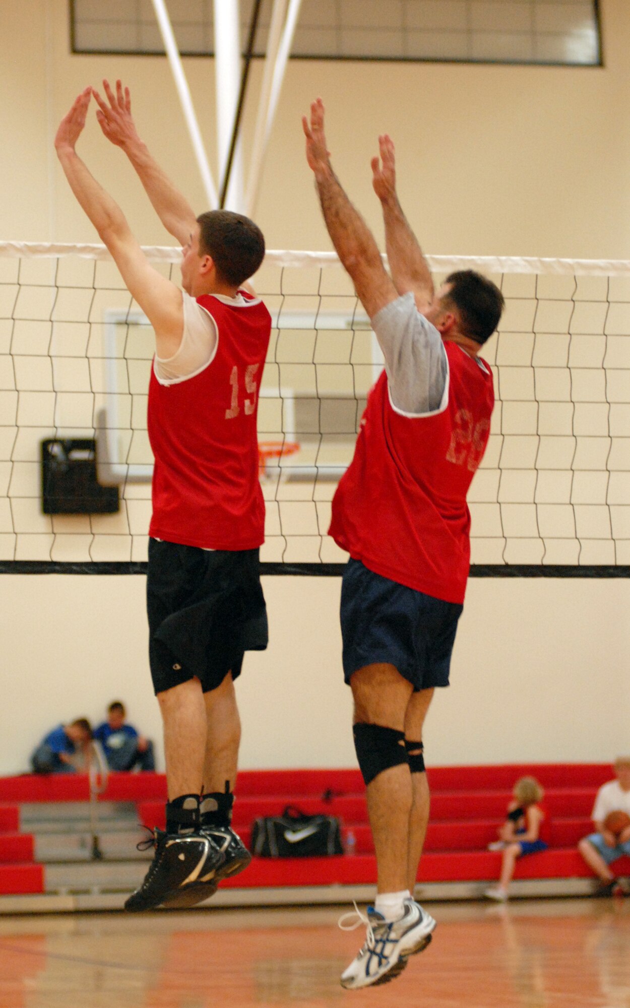 VANDENBERG AIR FORCE BASE, Calif. - - In an attempt to stop the 30th Space Wing Staff Agencies team from scoring, Anthony Vauclin and Justin Holtz, both members of 30th Space Communications Squadron team, rise to the occasion during an intramural volleyball game here Wednesday, March 24, 2010. The 30th SW Staff Agencies defeated the 30th SCS team 2-1. (U.S. Air Force photo/Airman 1st Class Angelina Drake)