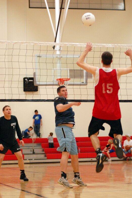 VANDENBERG AIR FORCE BASE, Calif. -- Returning a spike, Justin Holtz, a member of the 30th Space Communications Squadron team, continues the volley during an intramural volleyball game here Wednesday, March 24, 2010. The 30th Space Wing Staff Agencies team won the game 2-1 against 30th SCS team. (U.S. Air Force photo/Airman 1st Class Angelina Drake)