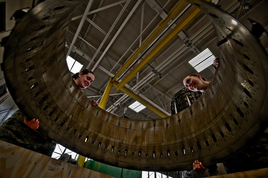 ELLSWORTH AIR FORCE BASE, S.D. -- (Left to right) Senior Airmen Erica Plymale and Angelique Hasz, 28th Maintenance Squadron aerospace propulsion journeymen, prepare an unserviceable engine part for turn in, March 11. Throughout history, women in the military have made significant contributions. The month of March has been recognized as Women's History Month since 1987 to highlight women of the past, present and future. (U.S. Air Force photo/Airman 1st Class Joshua J. Seybert)