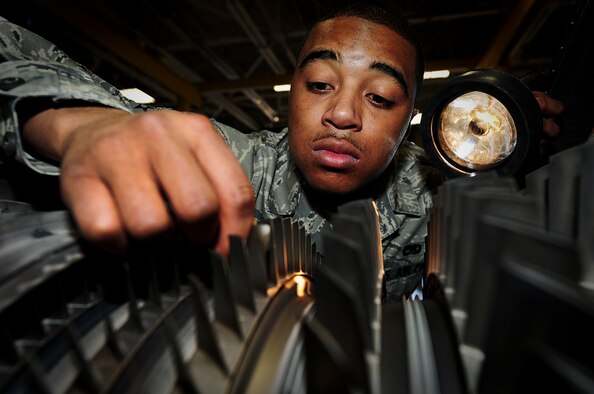 ELLSWORTH AIR FORCE BASE, S.D. - Airman 1st Class Desmond Jackson, 28th Maintenance Squadron aerospace propulsion technician, inspects a compression rotor on a B-1B Lancer engine, March 25. Engines are inspected after every 100 flying hours. (U.S. Air Force photo/Airman 1st Class Joshua J. Seybert)
