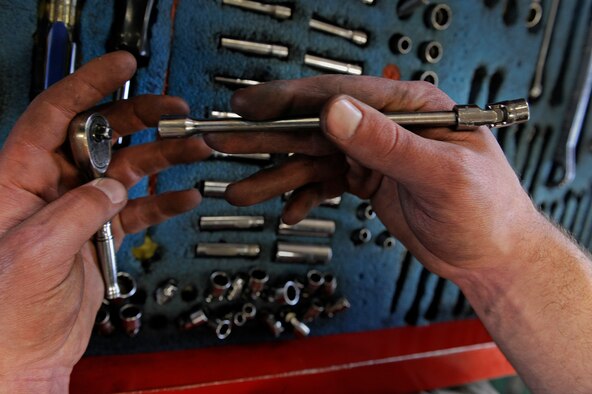 ELLSWORTH AIR FORCE BASE, S.D. – Airman 1st Class Benjamen Lundy, 28th Maintenance Squadron aerospace propulsion technician, places a universal socket with a six-inch extender onto a quarter-inch drive ratchet wrench, March 25.  The 28 MXS services 29 B-1s form both bomb squadrons. (U.S. Air Force photo/Senior Airman Marc I. Lane)