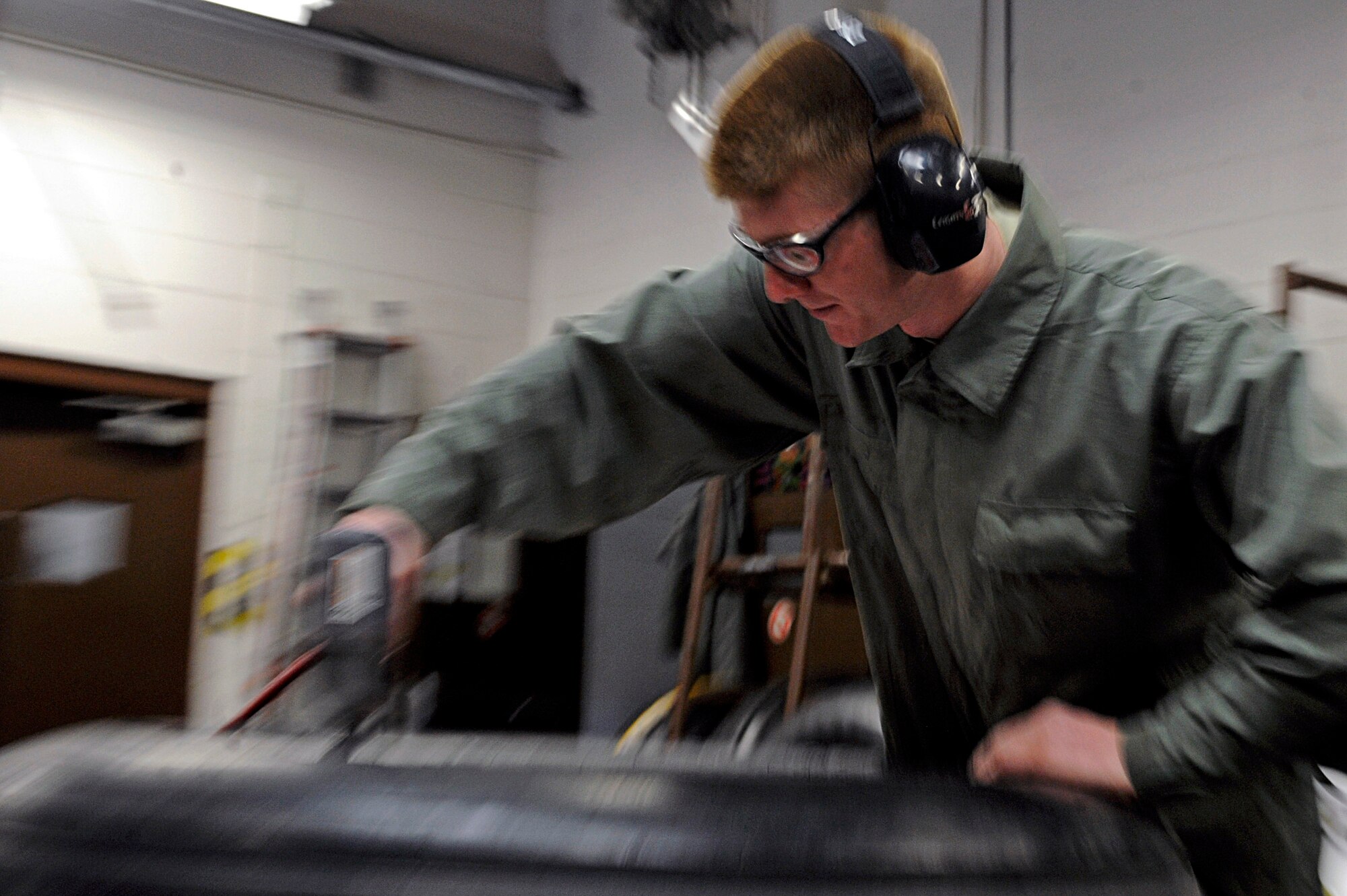 ELLSWORTH AIR FORCE BASE, S.D. -- Airman 1st Class Max Nelson, 28th Maintenance Squadron repair and reclamation apprentice, uses a torque wrench to tighten bolts on a tire, March 24. On average, it takes about 40 minutes to completely tear down and rebuild a tire. (U.S. Air Force photo/Airman 1st Class Matthew Flynn)